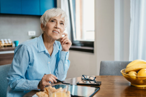 A woman experiencing decision fatigue pauses to stare into the distance with a confused look on her face.