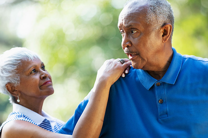 A man who struggles with dementia and poor judgment is comforted by his wife.